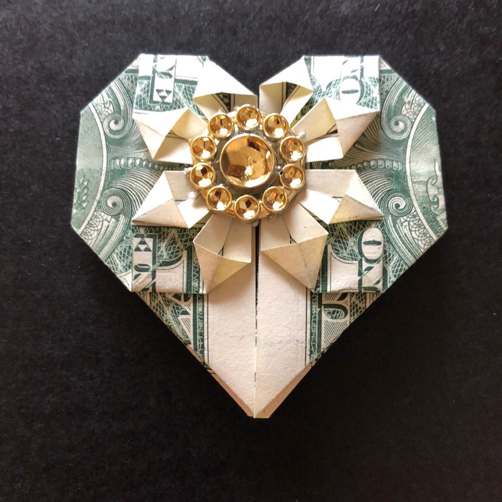 Hand made origami one dollar bill heart